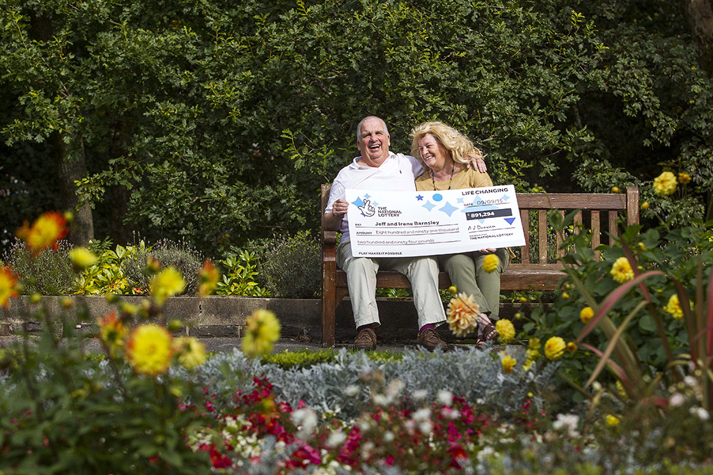 National Lottery scratch card winners with their cheque